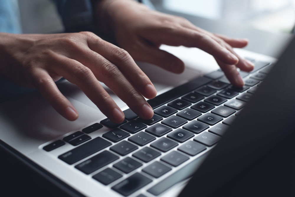Close,Up,Of,Business,Woman,Hands,Typing,On,Laptop,Computer